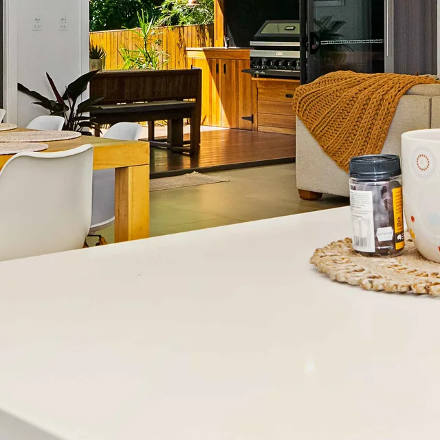 Close crop of the end of a stone kitchen island.